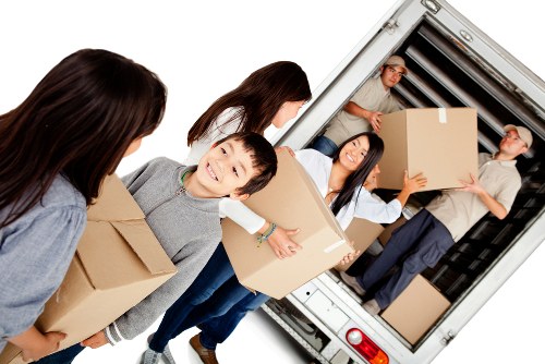 Removalists helping with a house move in Beckenham on a residential street