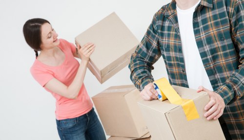 Removal van and moving team in a Beckenham residential street