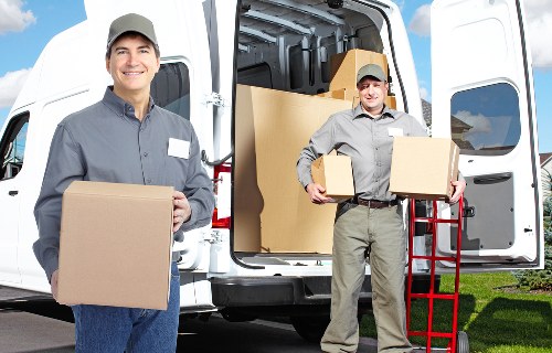 Packed moving boxes and furniture ready for removal in Beckenham