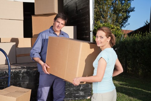 Packed boxes and furniture prepared for transport by local movers