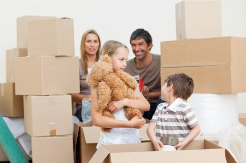 Packed moving boxes and furniture ready for transport in Beckenham